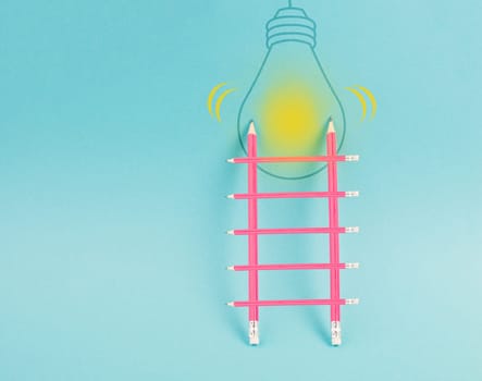 Ladder of success, having an idea, marketing and business concept, brainstorming for new goals, light bulb on wall