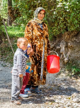 August 26, 2016, Margib village, Tajikistan: Children with their grandmother in a small village in Yaghnob region of Tajikistan