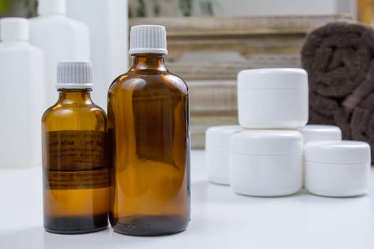 Glass bottle,cream and towels
