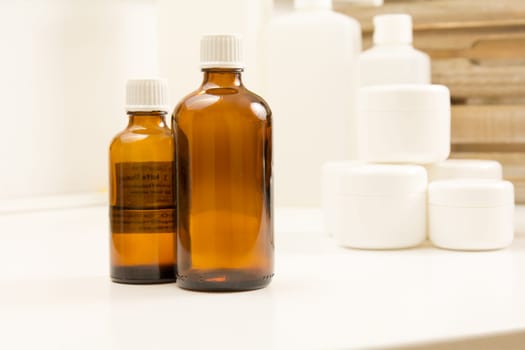 Glass bottle,cream and towels