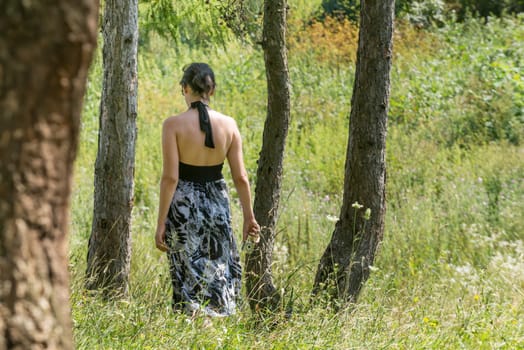An attractive girl walking in the forest