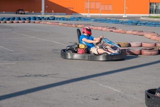 Man driving fast a Kart in a circuit lap in Kharkiv