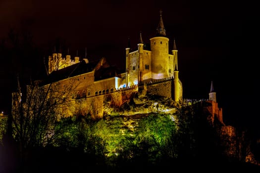 Alcazar of Segovia as the famous landmark aerial view at night in Spain