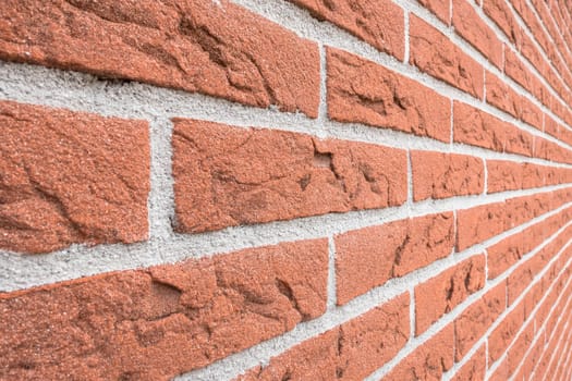 Red brick wall textured background. Construction material. Architecture. Horizontal. Vanishing point.