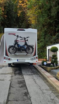 Bike racks on the camper. Campervan bikes on the rear rack of the RV for an outdoor nomadic lifestyle van camper van caravan vehicle for vacation trip living RV camping in the parking lot