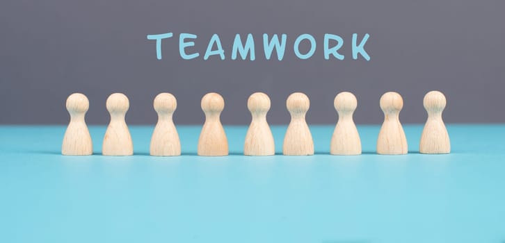 The word teamwork is standing over a group of people, working together as a team, corporation, communication and support concept