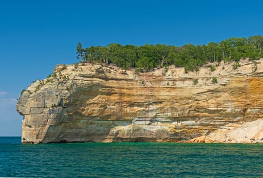 Massive Sandstone Cliffs on the Lakeshore in Lake Superior in Pictured Rocks National Lakeshore in Michigan