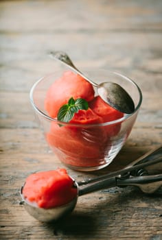 Fruit ice cream on rustic wooden table