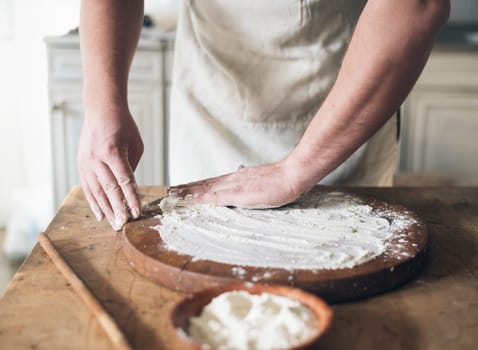 Man baking bread in the kitchen.