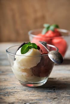 Ice cream scoops on rustic wooden table