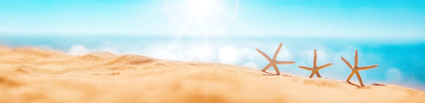 Starfishes on the beach sand in summer. Concept of tourism and vacation.