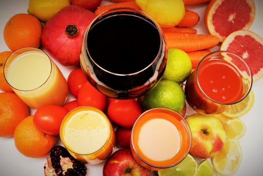 Healthy fruit and vegetable juices on a white background