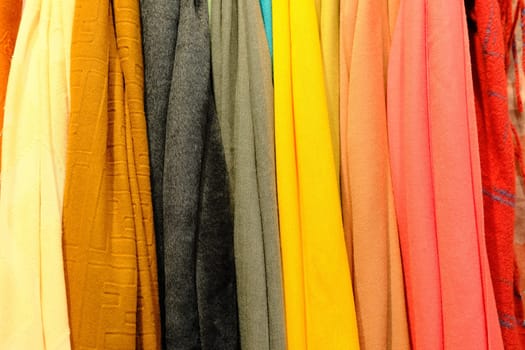 An isolated shot from colorful shawls made of silk fabrics colorful textile.