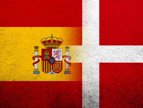 the Kingdom of Denmark National flag with Kingdom of Spain National flag. Grunge Background