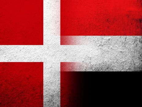 the Kingdom of Denmark National flag with National flag of Yemen. Grunge Background