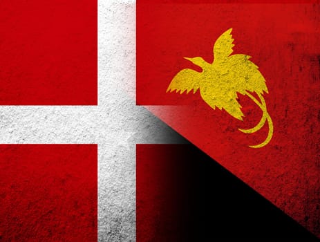 the Kingdom of Denmark National flag with The Independent State of Papua New Guinea National flag. Grunge Background