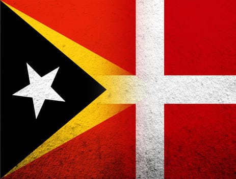 the Kingdom of Denmark National flag with Timor-Leste East Timor National flag. Grunge Background
