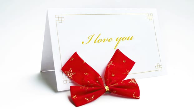 I love you text on greeteng card with bow