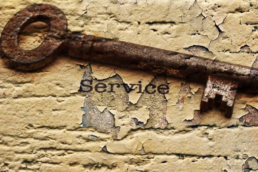 Old key on service text grunge concept