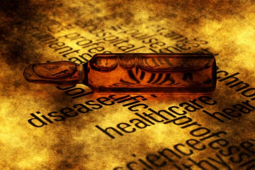 Medicine vial on grunge background