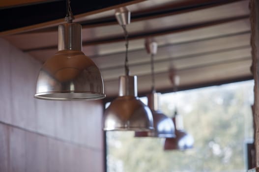 Line of Industrial hanging lamps. Selective focus