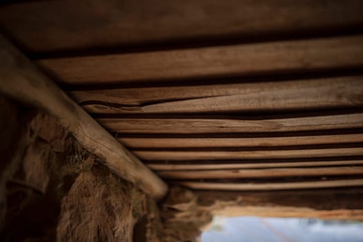 Old board roof covering a shepherds hut. Selective focus