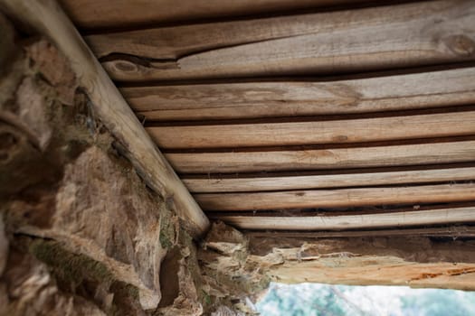Old board roof covering a shepherds hut. Selective focus