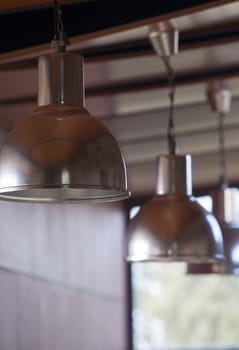 Line of Industrial hanging lamps. Selective focus