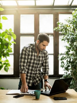 Young man working in cool workspace