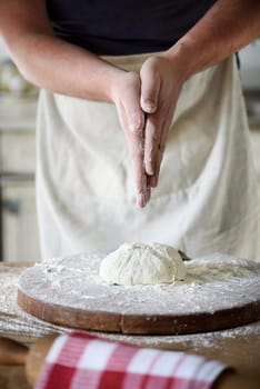 Man baking bread in the kitchen.
