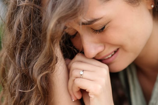 Sad woman after engagement complaining alone showing ring