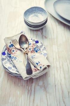 Sustainability concept - stoneware and kitchenware on wooden kitchen table