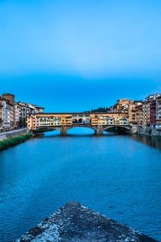 Florence, Italy - Circa June 2021: sunset on Ponte Vecchio - Old Bridge. Amazing blue light before the evening.
