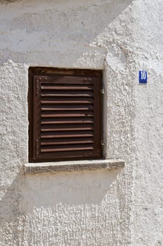 single window with shutter in the old town of Krk in Croatia