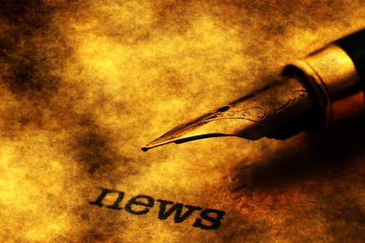 Fountain pen on news text
