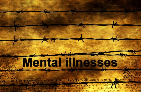 Mental illnesses text against barbwire