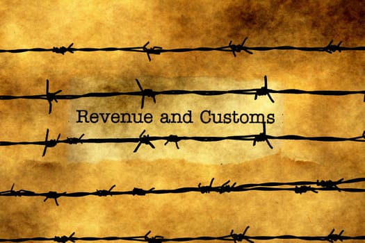Revenue and customs text against barbwire