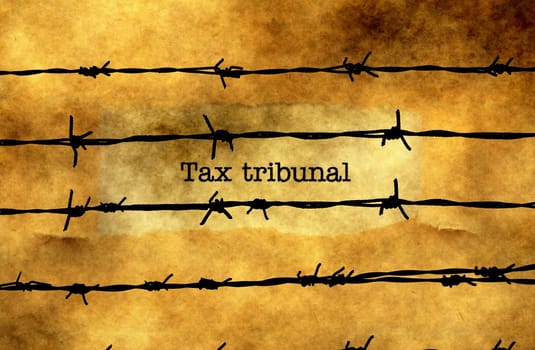 Tax tribunal text against barbwire
