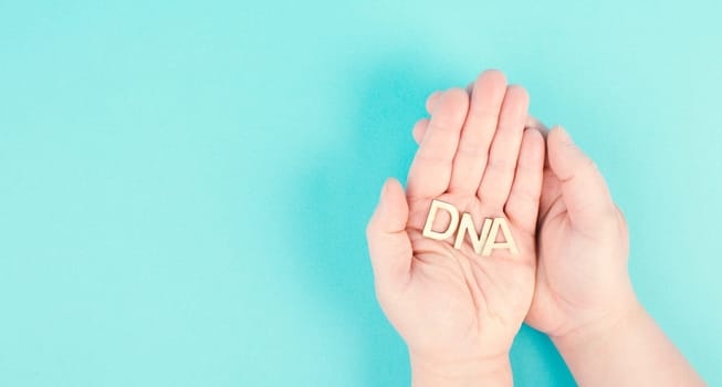 Holding the word DNA in the hands, genetic therapy and treatment, biotechnology in mordern medicine, health care