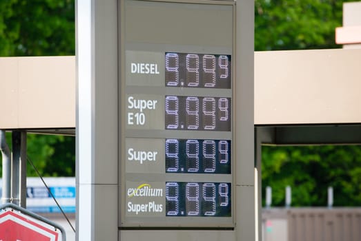 Display with the fuel prices for diesel and petrol, increasing costs, inflation at the gas station