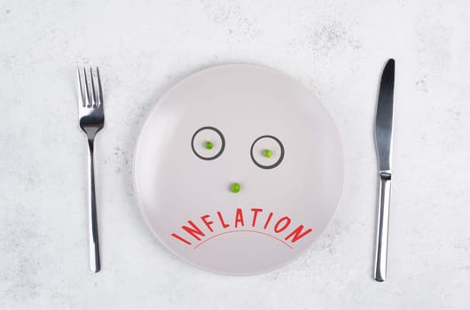 Inflation is standing on the plate, food shortage and starving because of the war ,famine, political issue, face with green peas