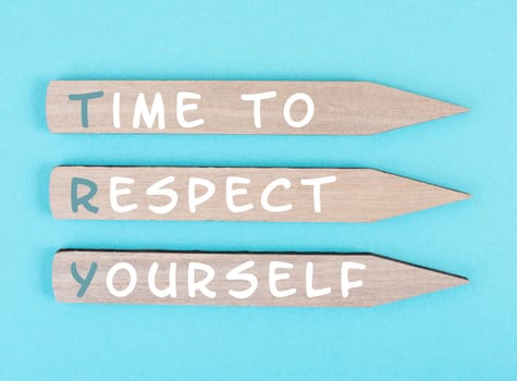 The words time to respect yourself are standing on wooden arrows, responsibility and development, motivation concept