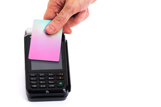 Attached plastic card to the payment terminal with a man's hand on a white isolated background, copy space. High quality photo