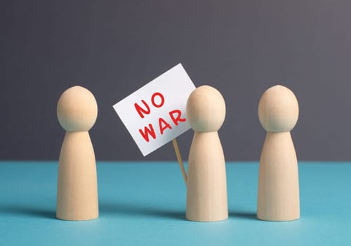 Group of protesters holding a sign with the words no war, demonstration for human right and freedom, political movement, activists for peace