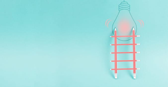 Ladder of success, having an idea, marketing and business concept, brainstorming for new goals, light bulb on wall