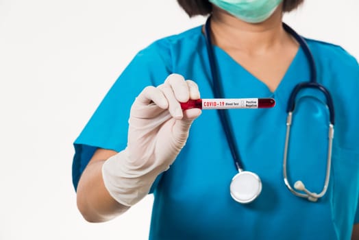 Nurse in blue uniform wear a mask holding test tube sample Coronavirus test blood in the laboratory for analyzing isolated on white background, medicine COVID-19 pandemic outbreak concept
