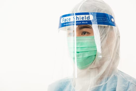Closeup woman medical staff doctor in PPE uniform wearing a face mask protective and plastic face shield for quarantine Coronavirus outbreak (COVID-19) isolated on white background