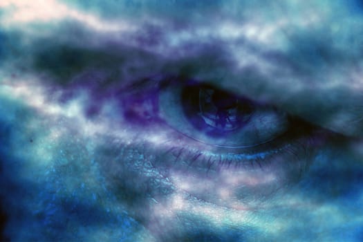 Blue human eyes closeup