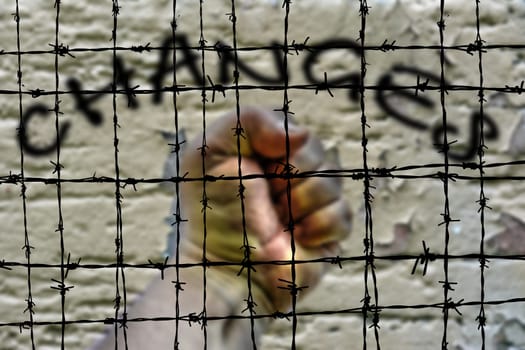 Changes and hand against Barbwire