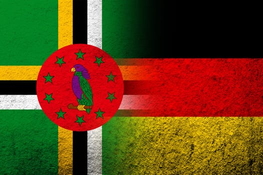 The national flag of Germany with Dominica National flag. Grunge background